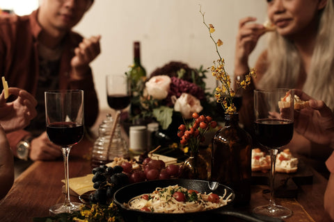 Red wine and flowers on a table