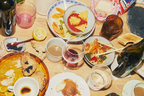A brunch table set with white wine