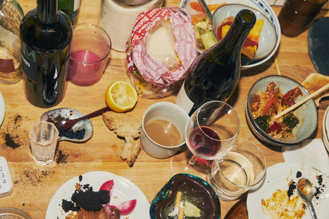A spread of wine bottles and glasses — best red wines under $50, from Cambridge Wines